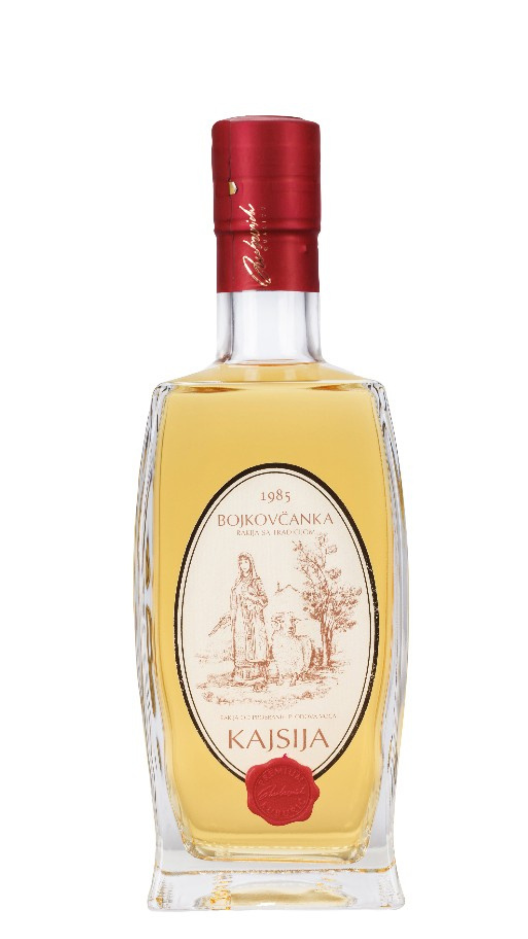 A bottle of Bojkovčanka Apricot Brandy with a label that includes a illustration of apricot trees and the name 'Kajsija'. The brandy is presented in a clear bottle with a golden yellow color visible, and the bottle is sealed with a red cap.