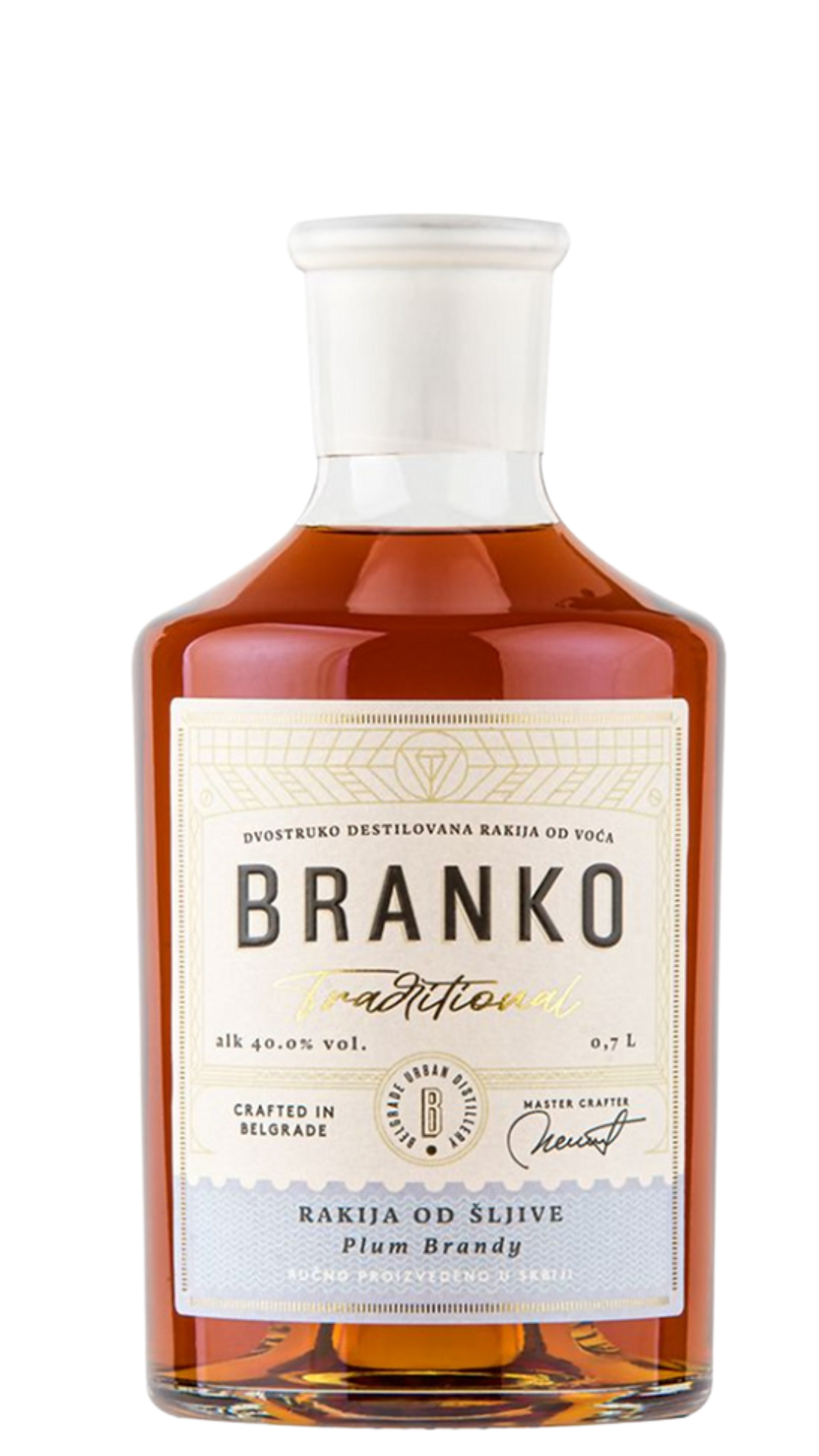 A bottle of Branko Traditional Plum Brandy with a clear amber liquid visible through the transparent glass. The label displays the brand name and product details.