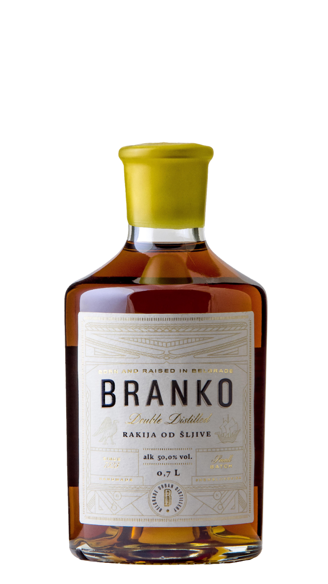 A bottle of Branko Premium Plum Brandy with a yellow cap and a label that includes the brand name and the percentage alcohol content.