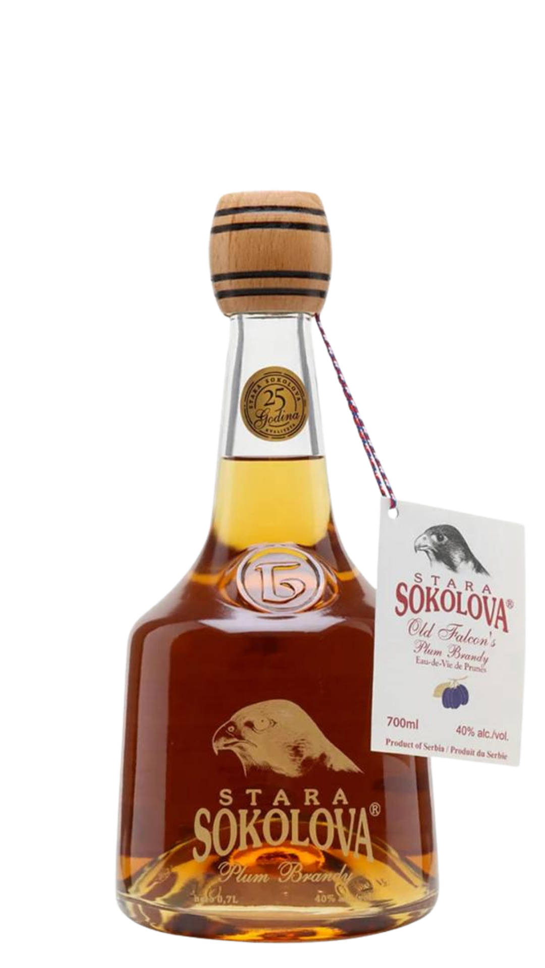 A bottle of Stara Sokolova rakija with a clear label showing the brand name and plum imagery, a golden-brown liquid, and a cork seal.