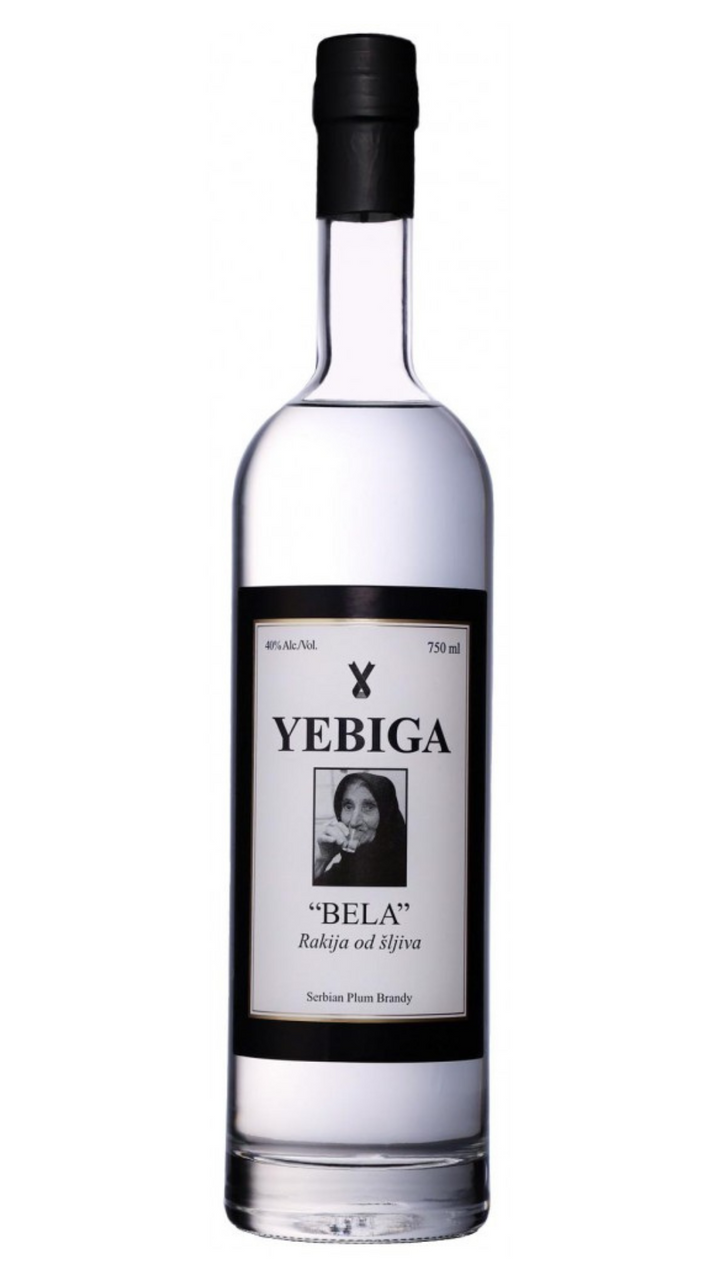 A clear glass bottle of YEBIGA Bela Plum Brandy with a black cap and a label featuring a portrait.