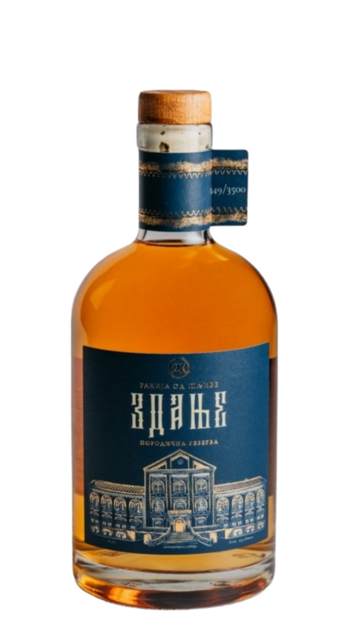 A bottle of Zdanje Plum 700ml 20 Y.O rakija with a blue label, clear glass, and a cork seal.